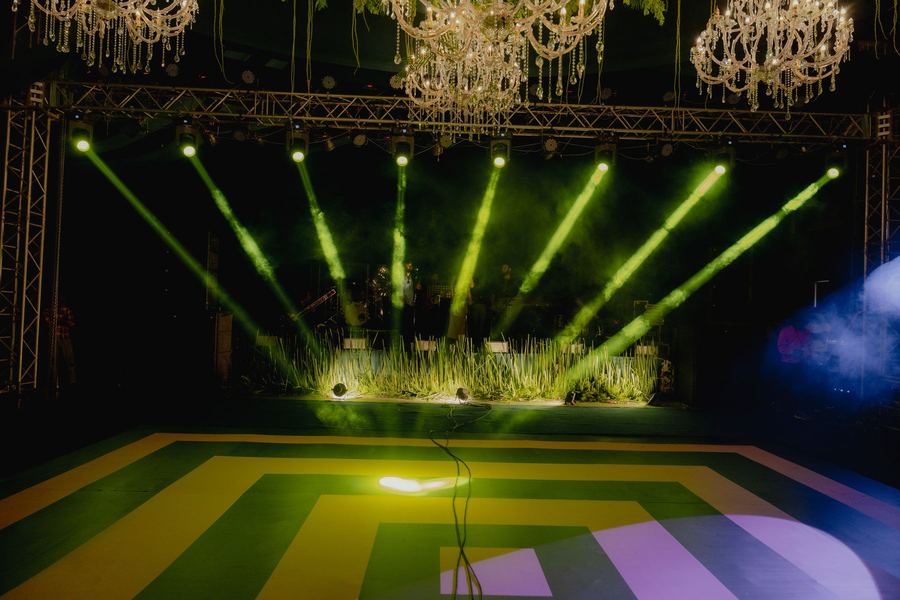 Green beam light show over the dance floor