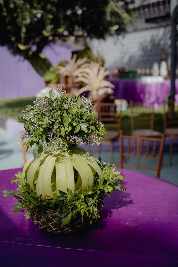 Sculptural leaf centrepiece on a violet table