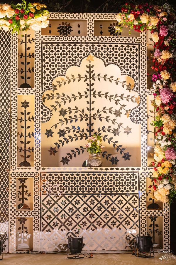 Carved jaali panel edged in cascading roses