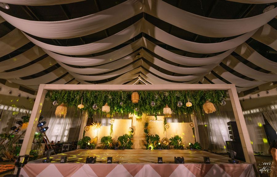 Draped white pavilion framing the sangeet stage