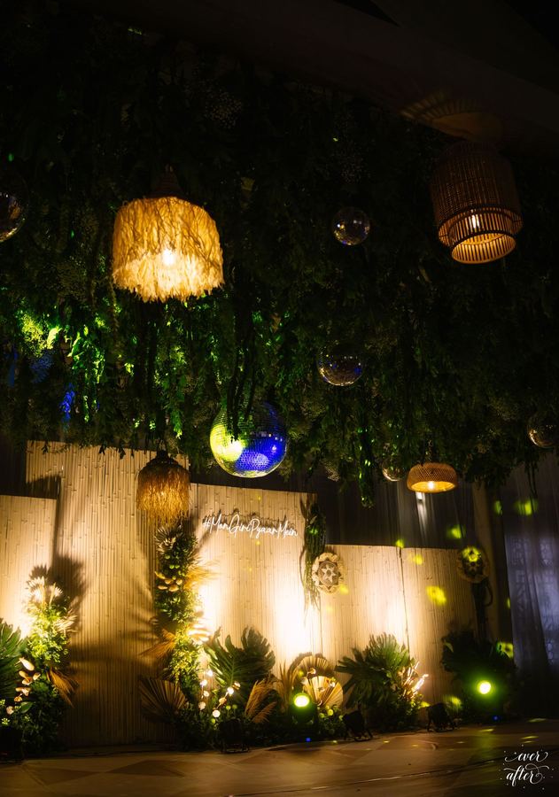 Bamboo backdrop with tropical plants and hanging lanterns
