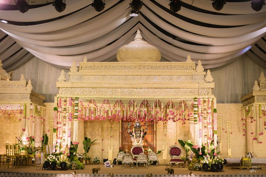 Front view of the ivory mandap with pink floral strands