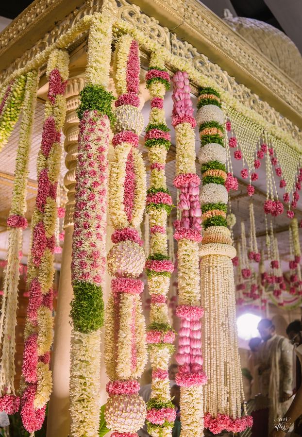 Hanging columns of jasmine, rose and marigold strands