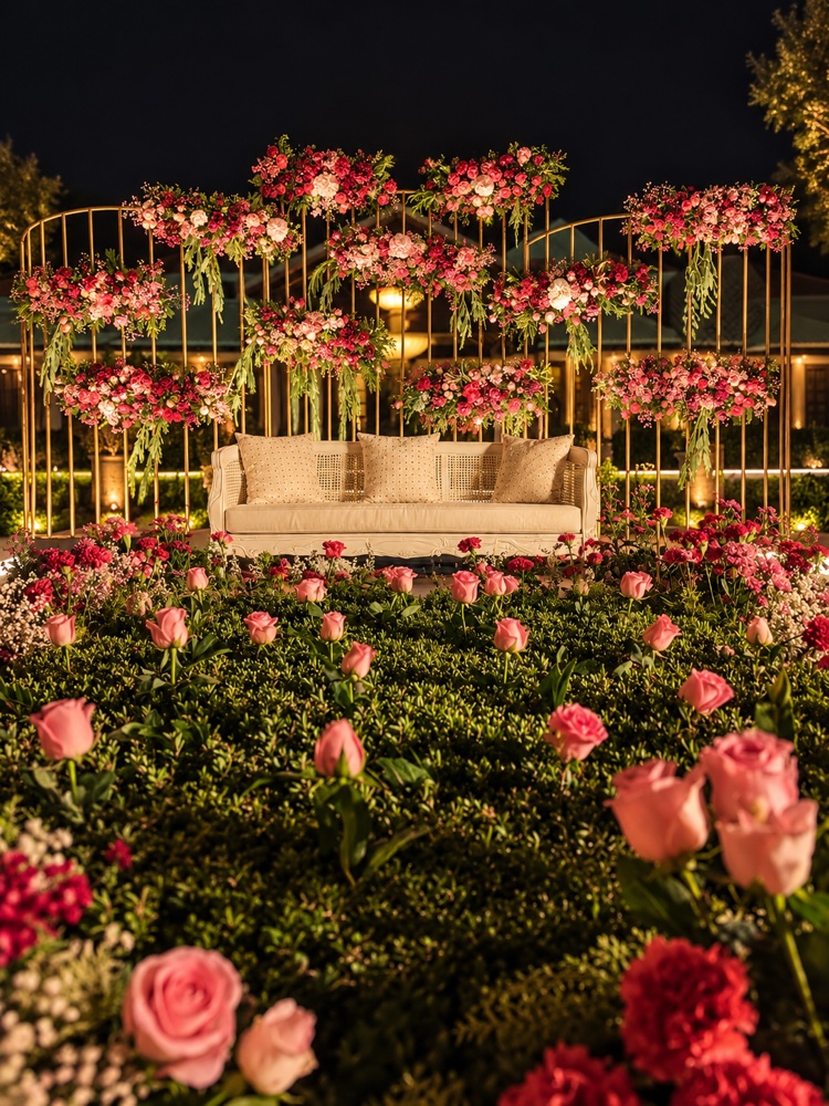 Rose garden lounge seating framed by gold floral panels